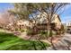 Nice backyard view featuring a well-maintained lawn, landscaping, and a charming fence for privacy at 1350 S Greenfield Rd # 1215, Mesa, AZ 85206