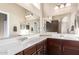 Bathroom featuring double sinks, large mirrors, and ample counter space at 1350 S Greenfield Rd # 1215, Mesa, AZ 85206