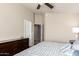 This main bedroom features a dresser and access to two doorways at 1350 S Greenfield Rd # 1215, Mesa, AZ 85206