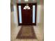 Inviting front entrance with dark wood door, sidelights, and decorative area rug at 150 W Tam Oshanter Dr, Phoenix, AZ 85023