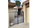 Courtyard entrance featuring an iron gate and pathway leading to the front door at 150 W Tam Oshanter Dr, Phoenix, AZ 85023