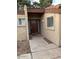 Charming front entrance featuring a solid wood door and desert landscaping at 150 W Tam Oshanter Dr, Phoenix, AZ 85023