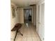 Hallway with tiled floors leading to the main room at 150 W Tam Oshanter Dr, Phoenix, AZ 85023