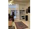 Comfortable living room featuring a decorative rug, recessed shelving and view to front door at 150 W Tam Oshanter Dr, Phoenix, AZ 85023