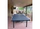 Covered patio featuring a ping pong table and an outdoor dining set at 150 W Tam Oshanter Dr, Phoenix, AZ 85023