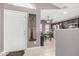 Interior view of the entryway leading to the kitchen with dark wood cabinets at 1565 E 10Th St, Casa Grande, AZ 85122