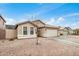 Lovely home with a two-car garage and low-maintenance front yard at 1565 E 10Th St, Casa Grande, AZ 85122