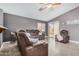 Spacious living room with a ceiling fan and sliding door to the patio at 1565 E 10Th St, Casa Grande, AZ 85122