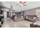 Living room featuring comfortable seating, neutral colors and tile flooring at 1565 E 10Th St, Casa Grande, AZ 85122