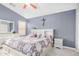 Comfortable main bedroom with a white dresser and a neutral colored ceiling fan at 1565 E 10Th St, Casa Grande, AZ 85122