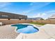 Enjoy the sun with this backyard pool surrounded by brick and turf grass at 1565 E 10Th St, Casa Grande, AZ 85122