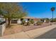 Street view of single-story home with desert landscaping and a gated carport at 15811 N 23Rd St, Phoenix, AZ 85022