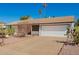 Single-story home with desert landscaping and a two-car garage and wide driveway at 15811 N 23Rd St, Phoenix, AZ 85022