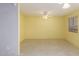 Bright open-plan living room features tile floors, neutral walls, and great natural light at 15811 N 23Rd St, Phoenix, AZ 85022