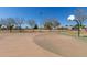 A view of the basketball court in the park with a basketball hoop at 1715 N Sawyer --, Mesa, AZ 85207