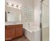 Bathroom with a soaking tub, shower, and wood vanity at 1715 N Sawyer --, Mesa, AZ 85207