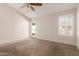 Carpeted bedroom featuring a ceiling fan, and a door to the patio at 1715 N Sawyer --, Mesa, AZ 85207