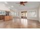 Open living space showcasing tile flooring, a kitchen island, and sliding door access to patio at 1715 N Sawyer --, Mesa, AZ 85207