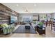 Comfortable living room features stylish furnishings, a ceiling fan and a decorative wood accent wall at 17839 W Maui Ln, Surprise, AZ 85388