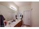 Bathroom featuring a double sink vanity with matching framed mirror and coordinated hardware at 1835 W Minton St, Phoenix, AZ 85041