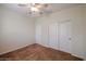 Bedroom featuring a ceiling fan, neutral paint, carpet, and a sliding door closet at 1835 W Minton St, Phoenix, AZ 85041