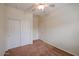 Bedroom featuring a ceiling fan, neutral paint and carpet, and a large closet at 1835 W Minton St, Phoenix, AZ 85041