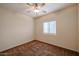 Cozy bedroom featuring a ceiling fan, neutral paint and carpet, and natural light from the window at 1835 W Minton St, Phoenix, AZ 85041