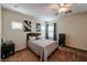 Comfortable bedroom featuring a ceiling fan, two windows, and neutral decor at 1835 W Minton St, Phoenix, AZ 85041