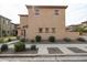 Rear view of stucco home with three small windows; landscaping includes decorative gravel and bushes at 1835 W Minton St, Phoenix, AZ 85041