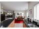 Open-concept kitchen and dining area with stainless steel appliances and modern decor at 1835 W Minton St, Phoenix, AZ 85041