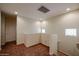 Upstairs loft with neutral colored carpet and paint, and a window for natural light at 1835 W Minton St, Phoenix, AZ 85041