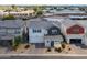 Stunning aerial view of a home showcasing a two-car garage and desert landscaping at 1901 W 23Rd Ave, Apache Junction, AZ 85120