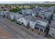 Aerial view of a backyard with a covered patio seating area, with canal and neighborhood views at 1901 W 23Rd Ave, Apache Junction, AZ 85120