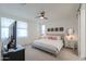 Bright bedroom features neutral tones, a ceiling fan, and modern decor for a cozy, inviting space at 1901 W 23Rd Ave, Apache Junction, AZ 85120