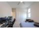 Bright bedroom featuring a large desk and a cozy reading nook with comfortable armchair at 1901 W 23Rd Ave, Apache Junction, AZ 85120