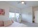 Bright bedroom with carpet features a ceiling fan and natural light, creating a comfortable and relaxing space at 1901 W 23Rd Ave, Apache Junction, AZ 85120