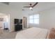 Bright bedroom features carpet, light gray walls, white trim, and a ceiling fan for a modern, inviting feel at 1901 W 23Rd Ave, Apache Junction, AZ 85120