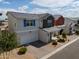 Charming two-story home features a gray roof, two-car garage, and manicured landscaping at 1901 W 23Rd Ave, Apache Junction, AZ 85120