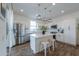 Bright kitchen featuring stainless steel appliances, white cabinetry, and a center island with seating at 1901 W 23Rd Ave, Apache Junction, AZ 85120