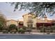 Beautifully landscaped home with a balcony, clay tile roof, and a charming facade with mature trees at 20299 N 102Nd Pl, Scottsdale, AZ 85255