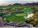 Expansive golf course view with manicured greens, sand bunkers, and mountain backdrop at 20299 N 102Nd Pl, Scottsdale, AZ 85255