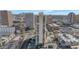 Stunning aerial view of a high-rise condo building with a pool, surrounded by the cityscape at 207 W Clarendon Ave # H10, Phoenix, AZ 85013