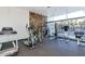 Community gym showcasing exercise equipment, a rock wall, and rubber flooring at 207 W Clarendon Ave # H10, Phoenix, AZ 85013