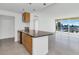 Stylish kitchen featuring an island and stainless steel appliances and city view at 207 W Clarendon Ave # H10, Phoenix, AZ 85013