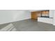 Open living space with modern kitchen and concrete floors at 207 W Clarendon Ave # H10, Phoenix, AZ 85013