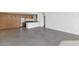 Open concept living space with modern kitchen and concrete floors at 207 W Clarendon Ave # H10, Phoenix, AZ 85013