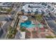 Aerial pool view showcasing lounge seating, unique shaded area, and lush landscaping at 207 W Clarendon Ave # H10, Phoenix, AZ 85013