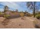 Backyard of home with desert landscaping and covered patio at 2142 E Palmcroft Dr, Tempe, AZ 85282