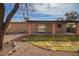 Backyard view of covered patio perfect for entertaining and desert landscaping at 2142 E Palmcroft Dr, Tempe, AZ 85282