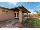 Backyard with covered patio, brick columns, and landscaped yard is perfect for entertaining at 2142 E Palmcroft Dr, Tempe, AZ 85282